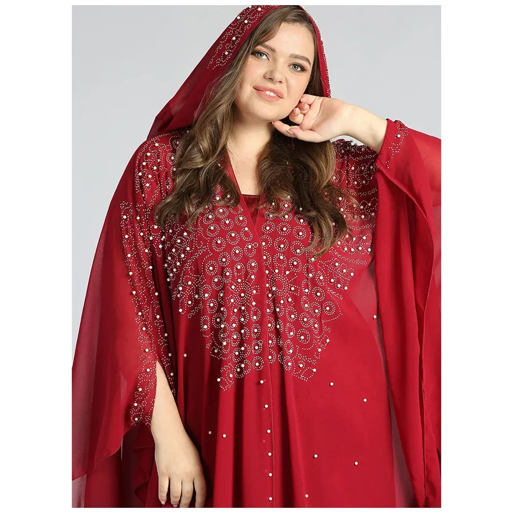 Moroccan Hooded Abaya featuring a stylish design with wide batwing sleeves and a flowing maxi silhouette.
