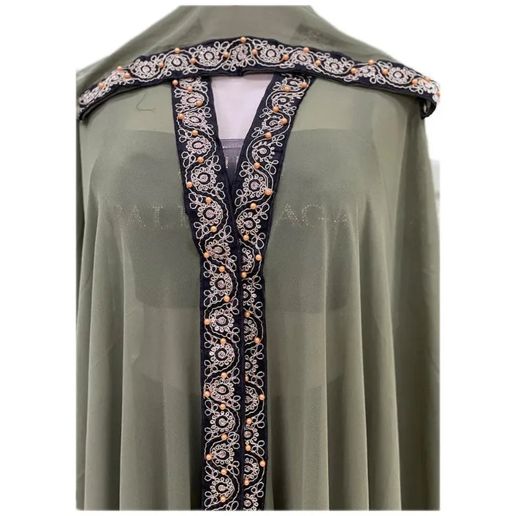 Moroccan Hooded Abaya featuring a stylish design with wide batwing sleeves and a flowing maxi silhouette.
