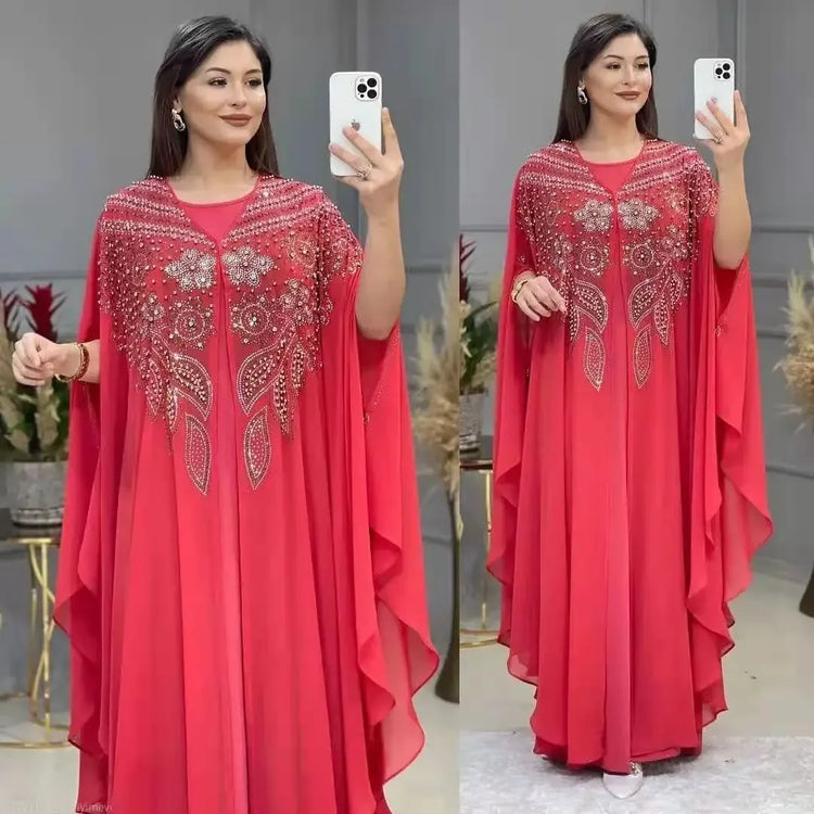 Elegant woman wearing a Plus Size African Dress featuring intricate embroidery, showing the flowing chiffon design in a stylish setting.