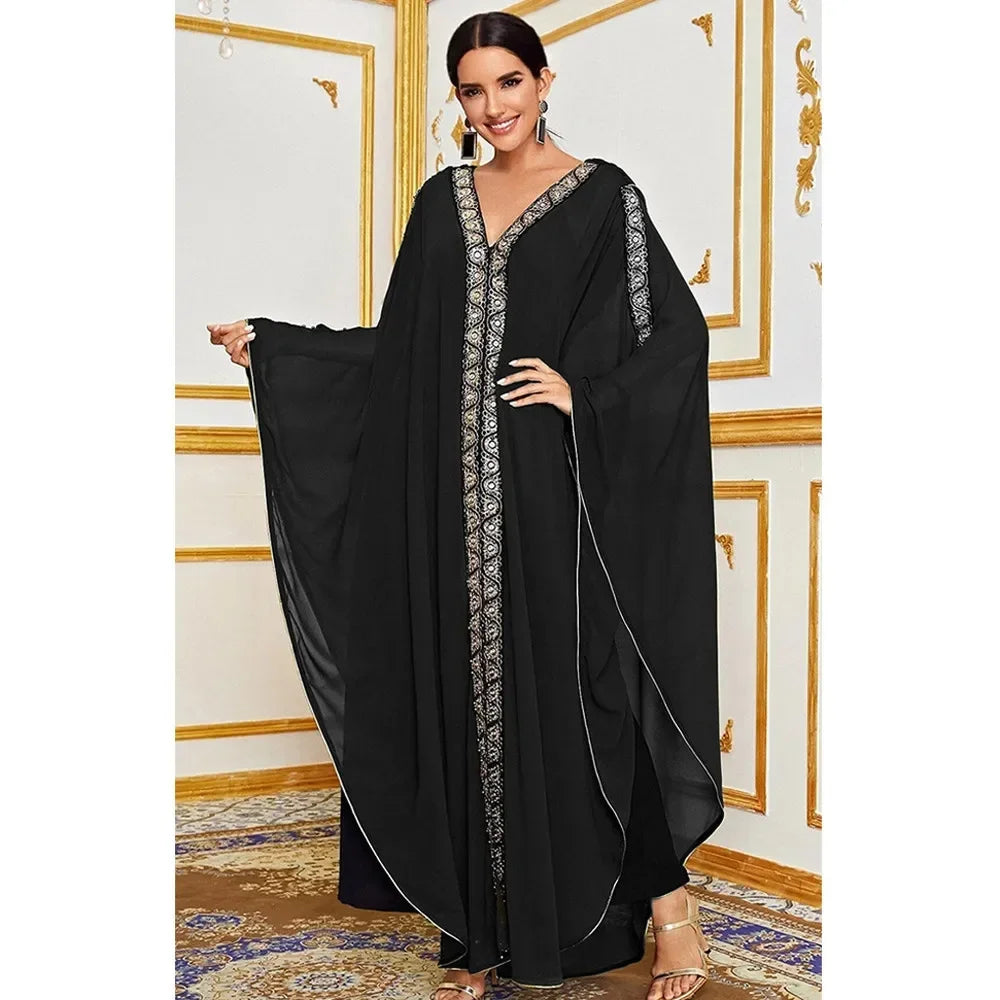 Moroccan Hooded Abaya featuring a stylish design with wide batwing sleeves and a flowing maxi silhouette.