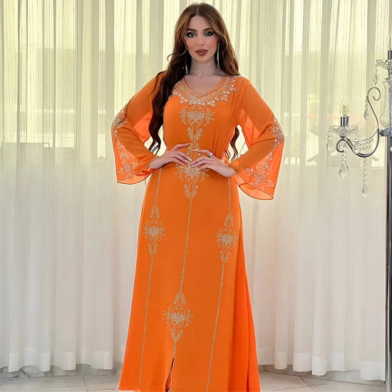 Muslim Abaya for Women in orange with elegant embroidery and long sleeves, perfect for modest everyday wear.