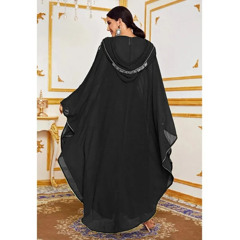 Moroccan Hooded Abaya featuring a stylish design with wide batwing sleeves and a flowing maxi silhouette.